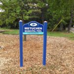 Metuchen Pool Wooden Sign between two wooden posts. New Jersey Sign Company